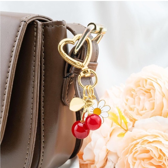 Red Cherry with Daisy bag accessories clip featuring gold hardware - Picture 3 of 3